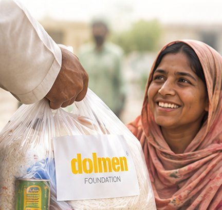 A volunteer handing a ration bag to a smiling woman